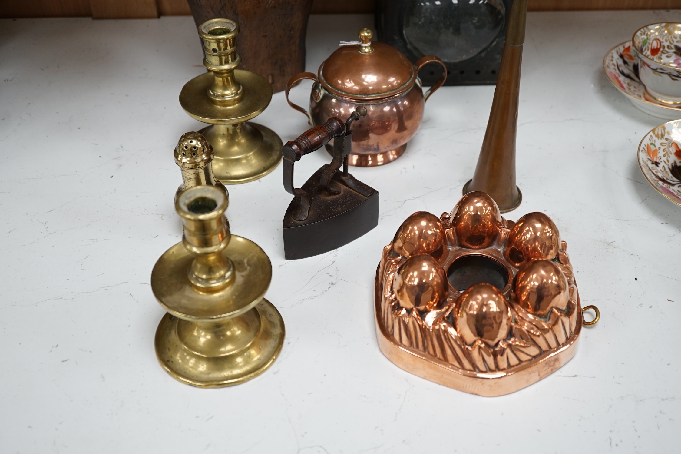 A Toleware lantern, a hatter's block, a copper jelly mould, a slug iron and three other items, tallest 34cm (7). Condition - fair to good